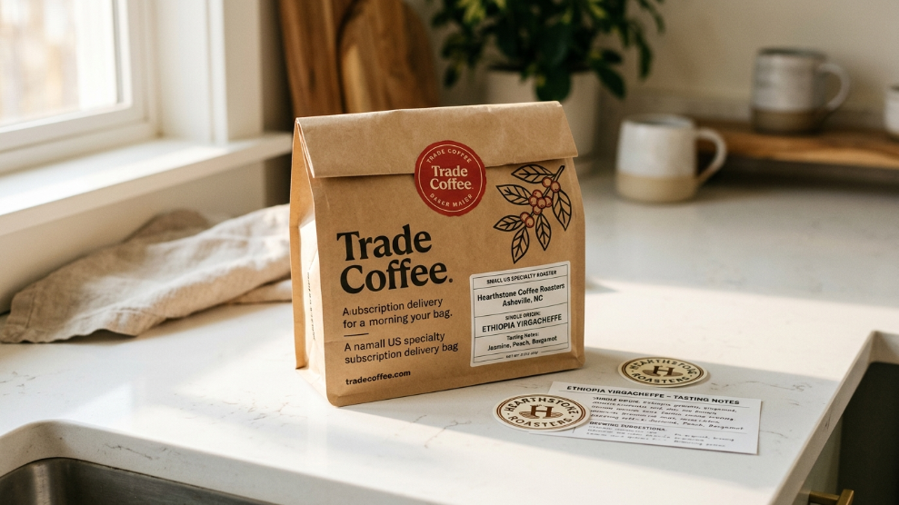 Trade Coffee subscription delivery showing a specialty roaster bag with Trade Coffee branding seal and a sticker on a clean white kitchen bench