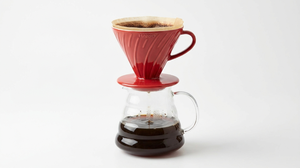 Hario V60 ceramic pour-over dripper size 02 in red on top of a glass server