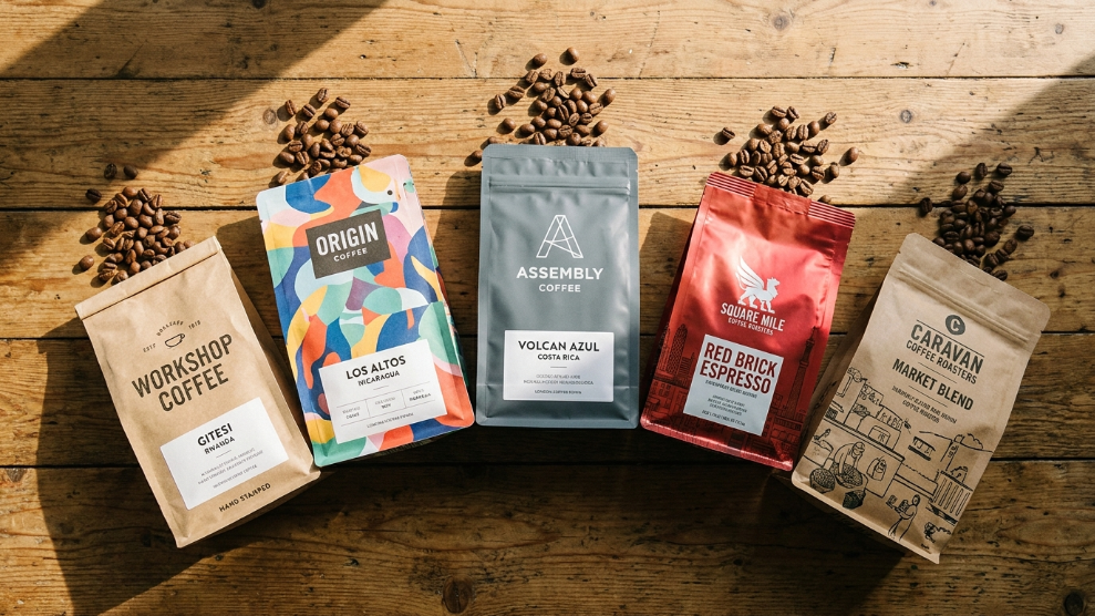 Best coffee roasters London online 2026 showing five specialty roaster bags from different London roasters arranged on a wooden surface