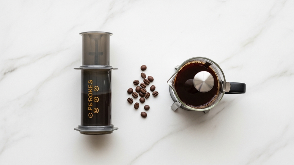 AeroPress vs French Press comparison showing both brewers side by side on a kitchen counter
